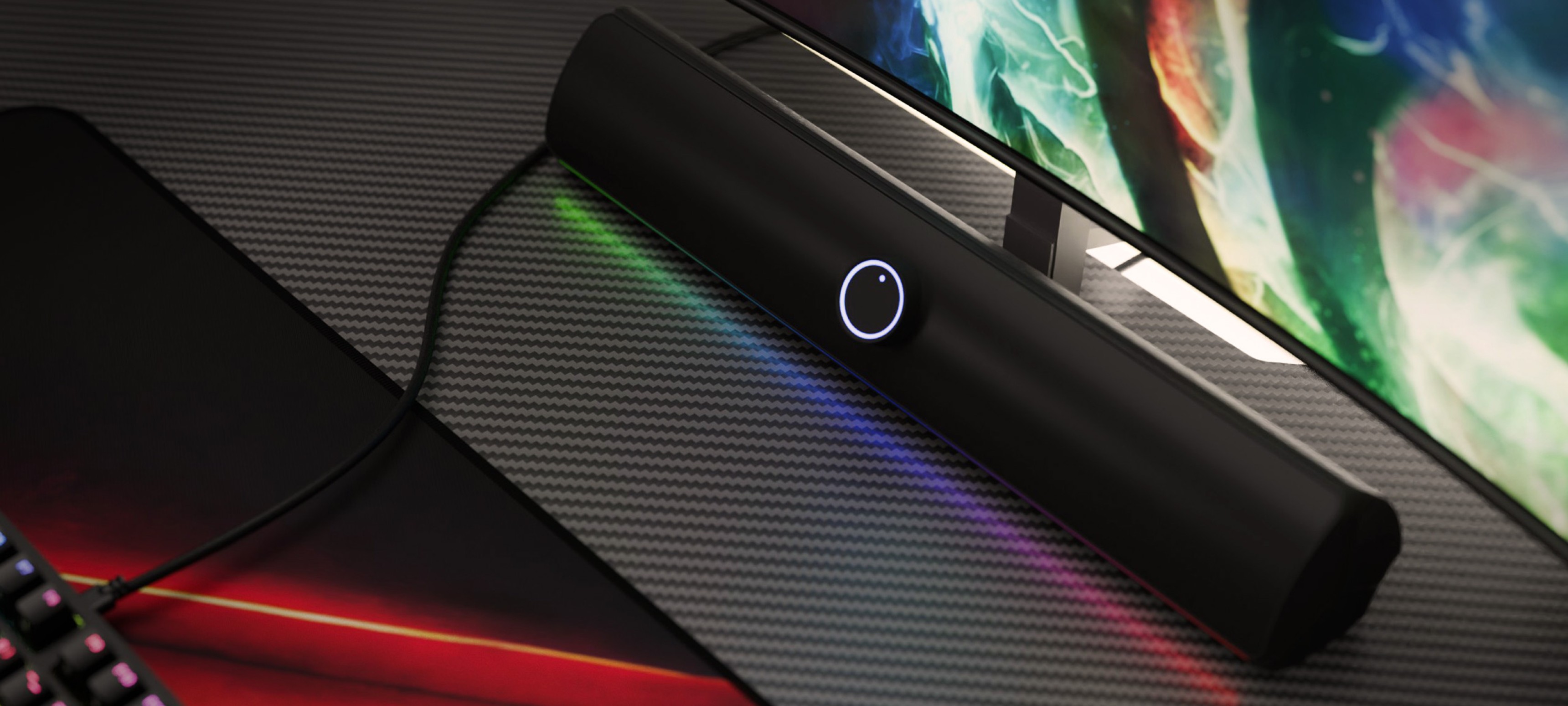 Soundbar Bluetooth s elegantním černým designem, podsvíceným ovládacím tlačítkem a barevnými LED akcenty.