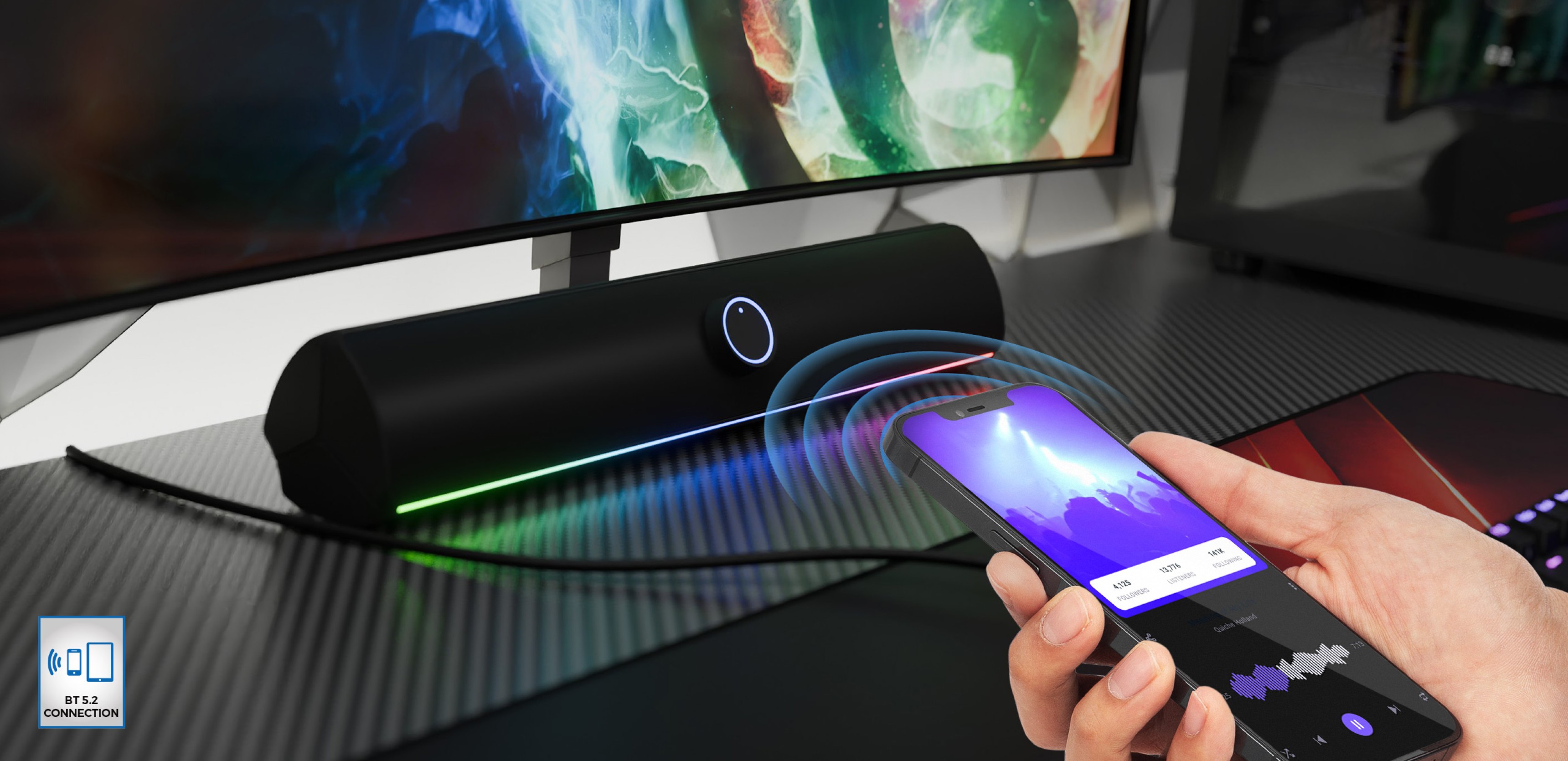 Bluetooth soundbar v černé barvě s LED osvětlením, bezdrátově ovládaný chytrým telefonem na stole